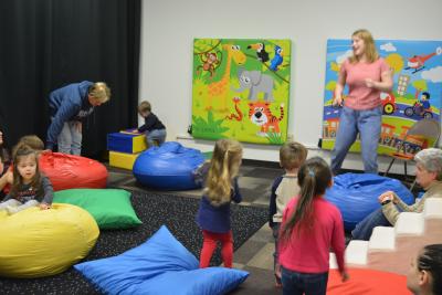 Miss Kristin leads story time in the Sensory Space.