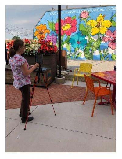 Ms Cindy prepared to film Storytime in Umbrella Alley