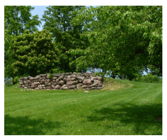 The tone wall at Metzger Park, once the foundation of the bank barn.