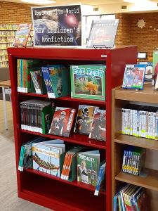 selected new children's nonfiction is on the red shelf at the end of the NEW books shelves