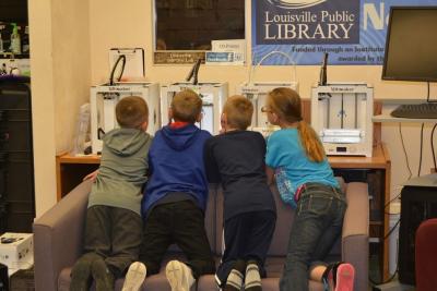 Kids watch the 3D Printer at work.